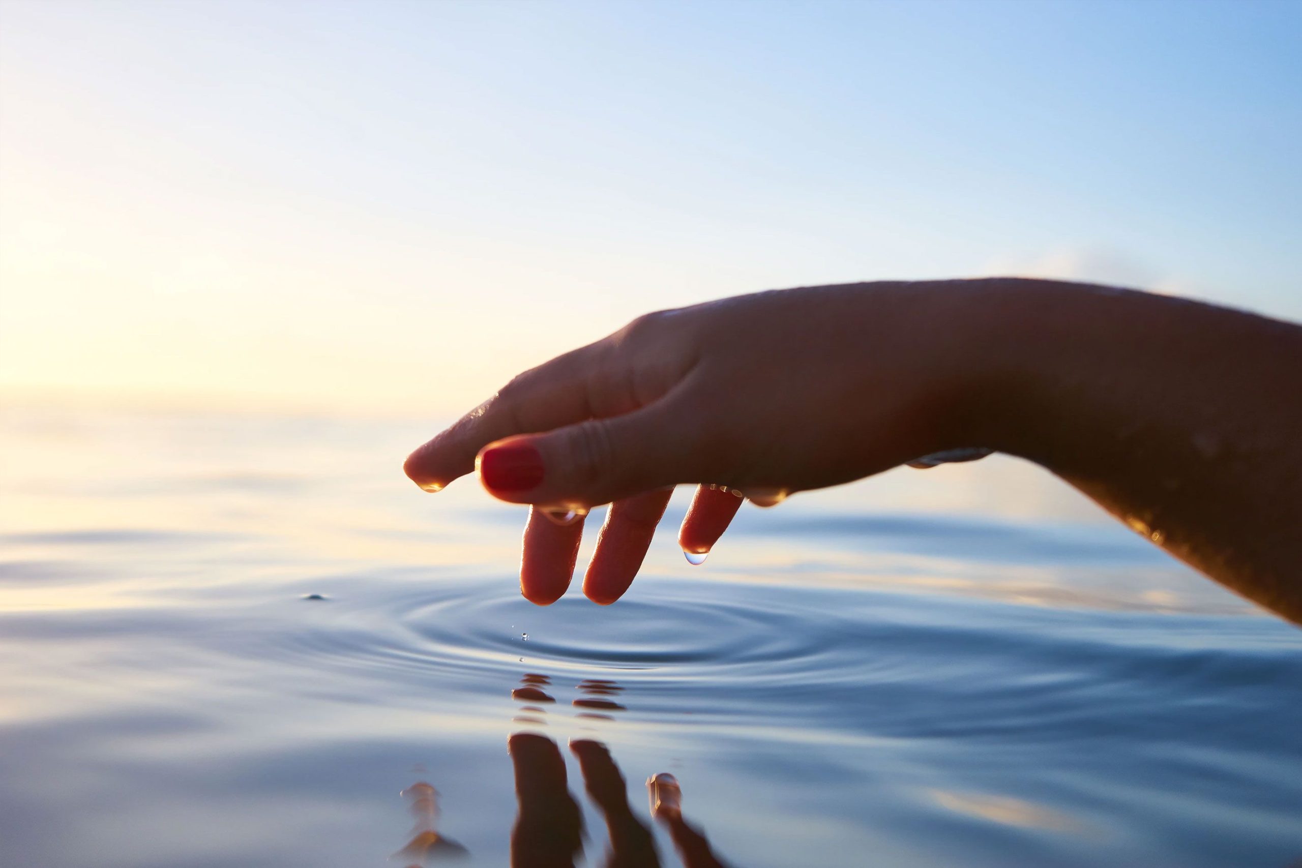Hand Touching Water Hand Touching Water